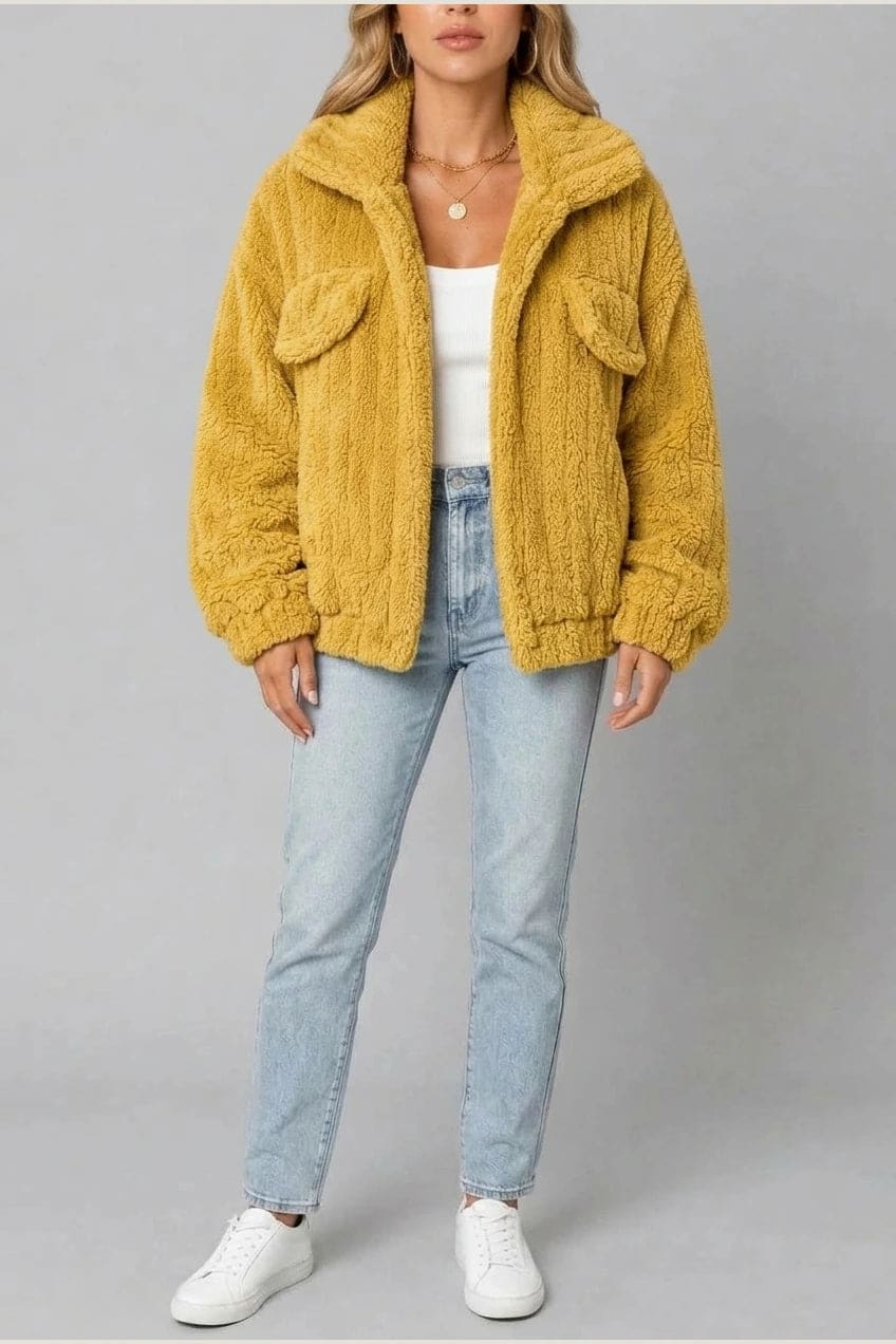 Cropped textured fleece jacket with wide collar, open front, chest flap pockets and elasticated cuffs, worn over a tank top with straight leg jeans and white trainers._6