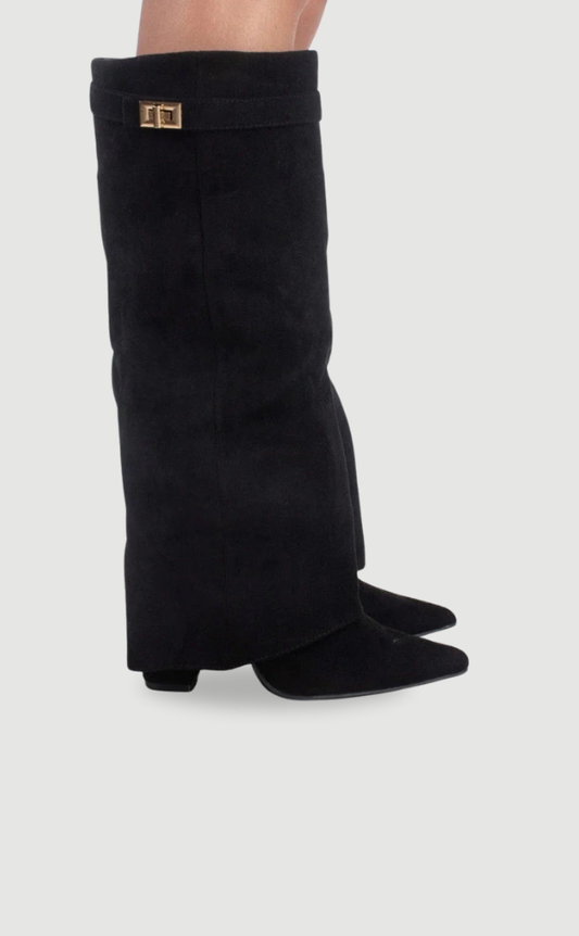 Black knee-high boots with pointed toes, fold-over cuffs, small metallic accents, and low heels shown in side view.