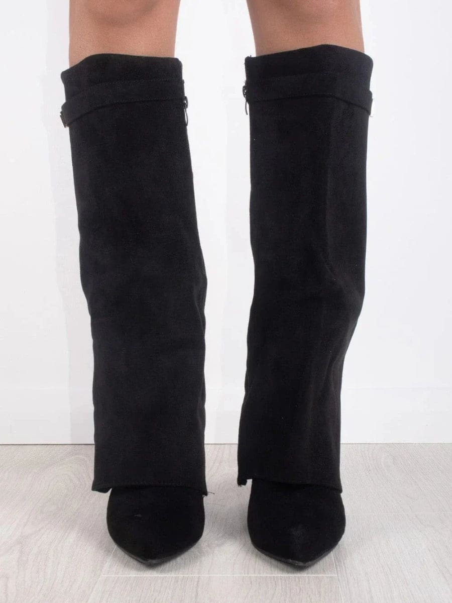 Front view of the black pair showing the knee-high shafts, fold-over cuffs, and pointed toe shapes.