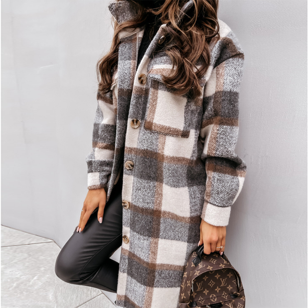 Woman wearing a long checked hooded button-front shacket with chest pockets and turnback cuffs, holding a small backpack._0