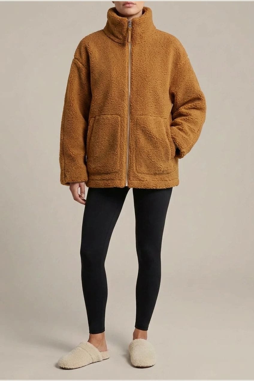 Oversized zip-up teddy fleece jacket with a high standing collar and two front patch pockets, worn with leggings._1