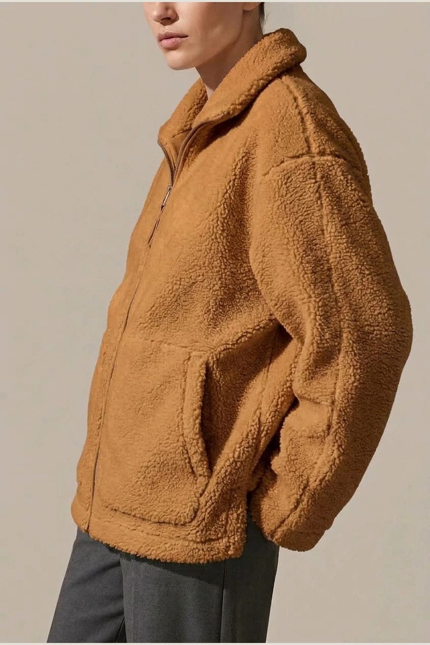 Oversized zip-up teddy fleece jacket with a high standing collar and two front patch pockets, worn with leggings._4