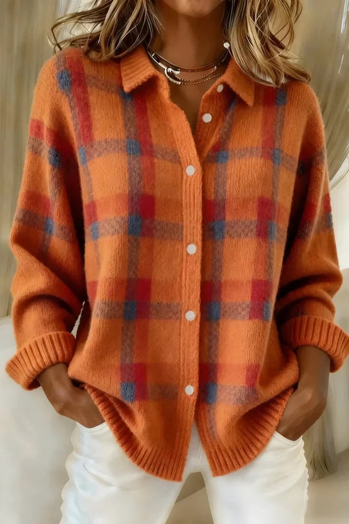 Orange plaid cardigan accented with red and blue checks, a pointed collar, white front buttons, and ribbed cuffs.