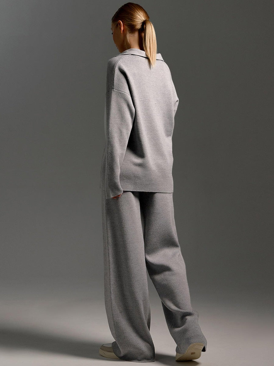 Back view of the gray polo sweater and wide-leg pants set, highlighting the relaxed fit.