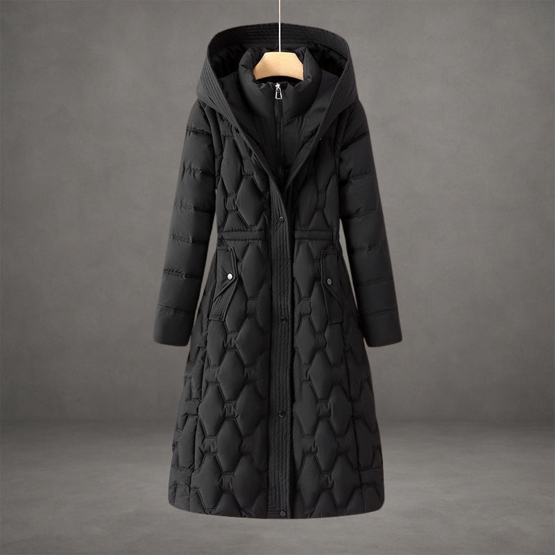 Black quilted hooded longline coat with a high collar beneath the hood, full-length front closure, and side flap pockets.