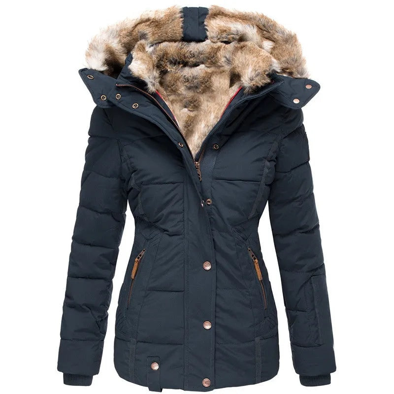 Front view of the navy quilted hooded puffer jacket with the faux-fur trim spread around the open hood and the full snap-and-zip front visible.