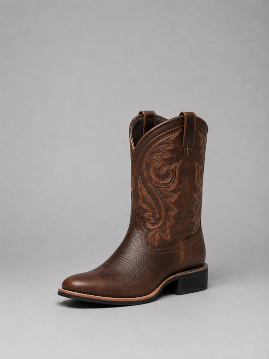Brown embroidered Western cowboy boot shown at a three-quarter angle, with a tall decorative stitched shaft, pointed toe, and sturdy block heel.
