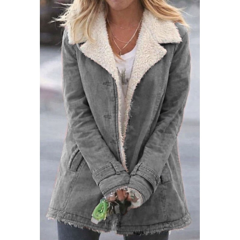 Gray mid-length coat with a plush cream sherpa-lined notched collar, front pockets, and button front.