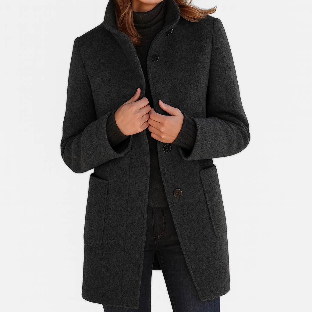 Charcoal gray women's coat with a raised stand collar, dark front buttons, long sleeves, and large lower patch pockets.