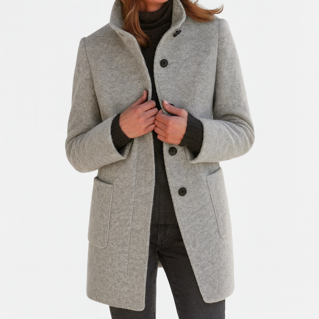 Light gray button-front coat with a structured stand collar, thigh-length cut, long sleeves, and two front patch pockets.