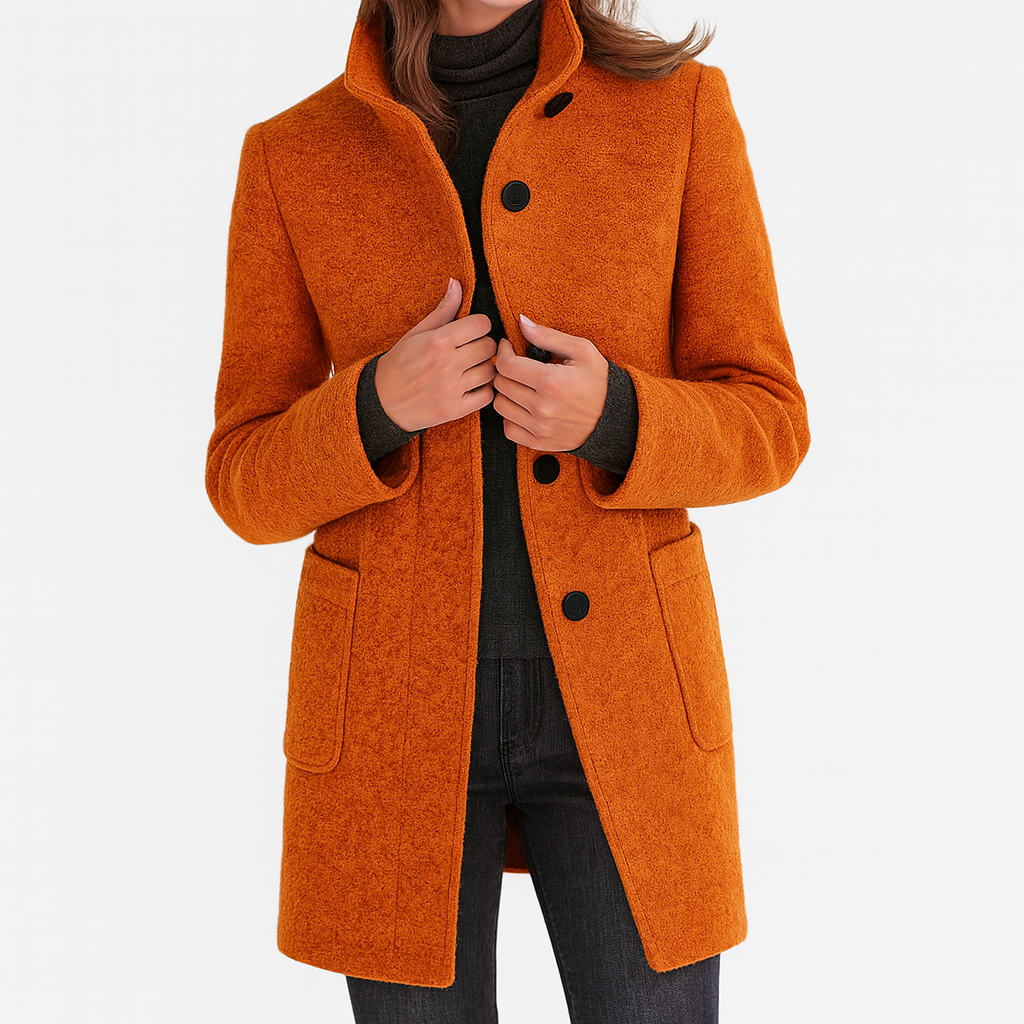 Burnt orange stand-collar coat with a row of dark buttons, long sleeves, and two front patch pockets.