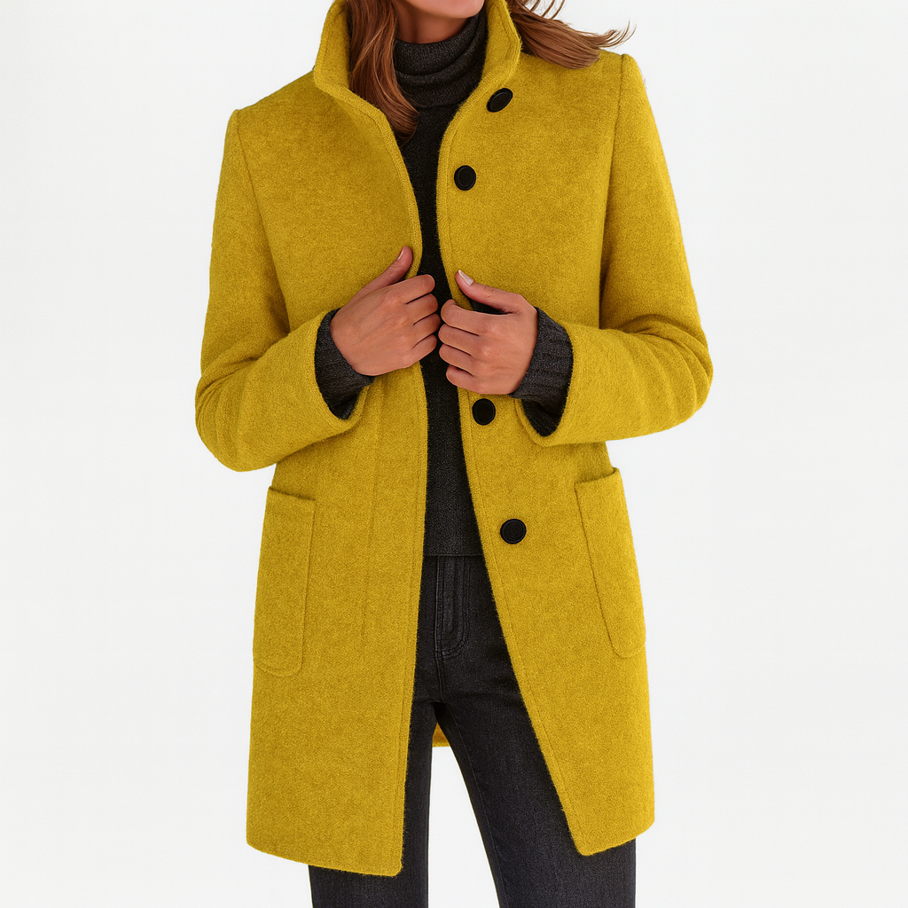 Mustard yellow women's coat with a structured stand collar, dark button closure, long sleeves, and front patch pockets.