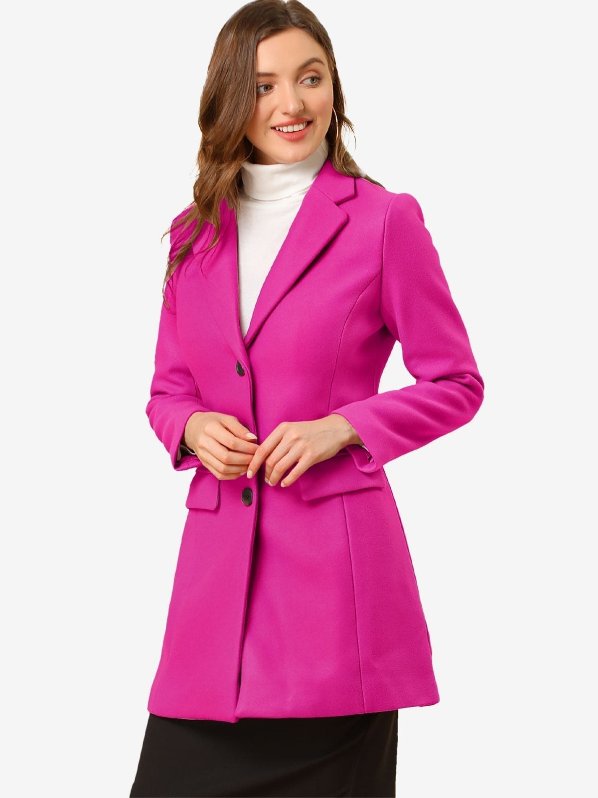 Bright fuchsia tailored coat with notched lapels and dark buttons, worn over a light turtleneck.