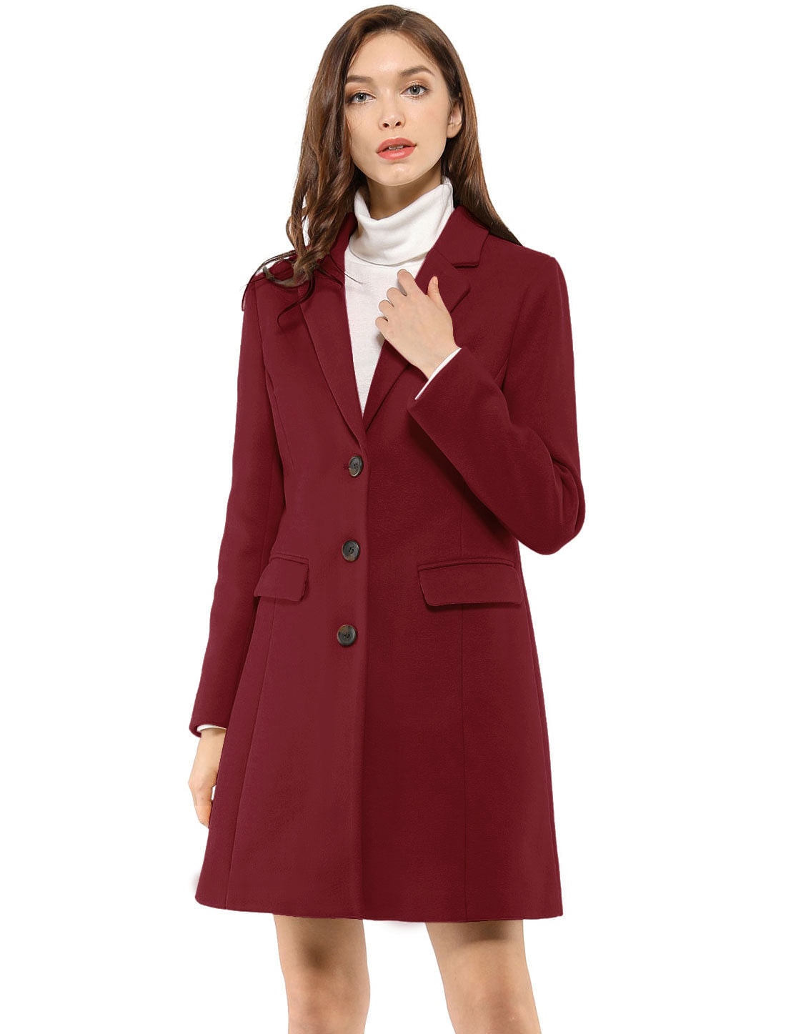 Burgundy button-front lapel coat worn closed over a white turtleneck, with both flap pockets visible.