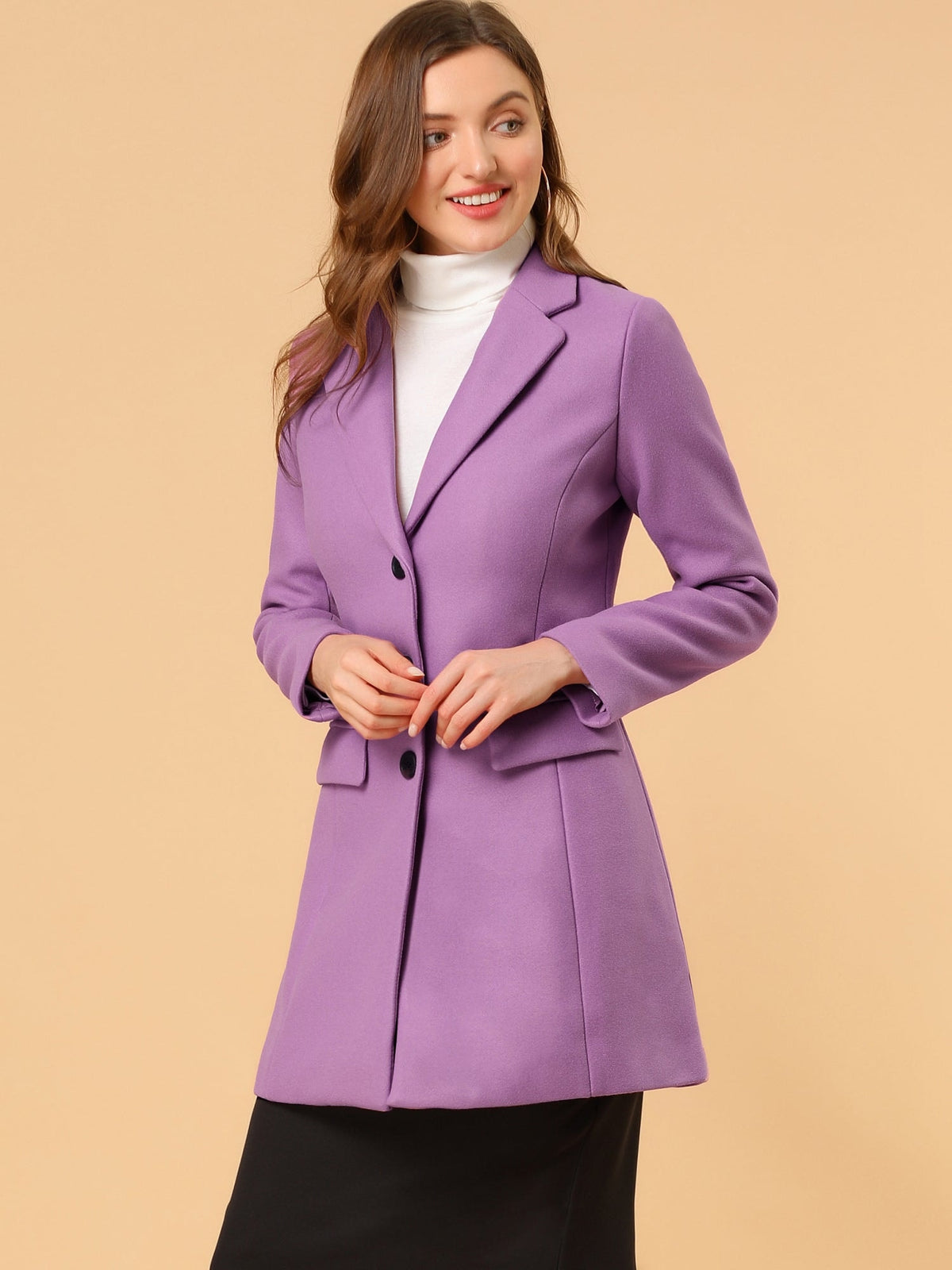 Purple tailored lapel coat worn over a white turtleneck and black skirt, with the button front held together.