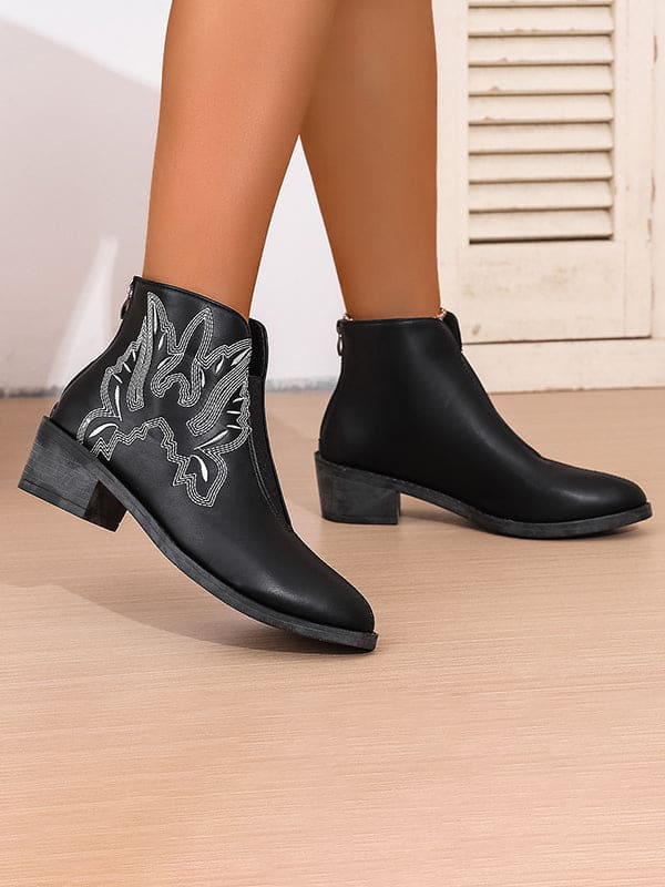 Brown ankle boots with white Western embroidery and elastic side panels, styled on a model wearing an anklet._3