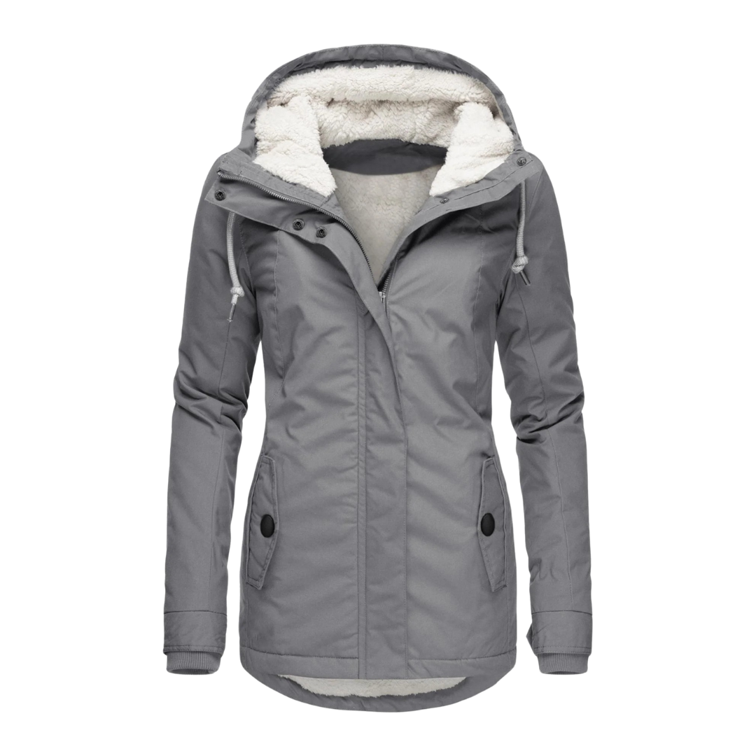 A model wears a hooded longline winter jacket with a front zip closure and front pockets._5
