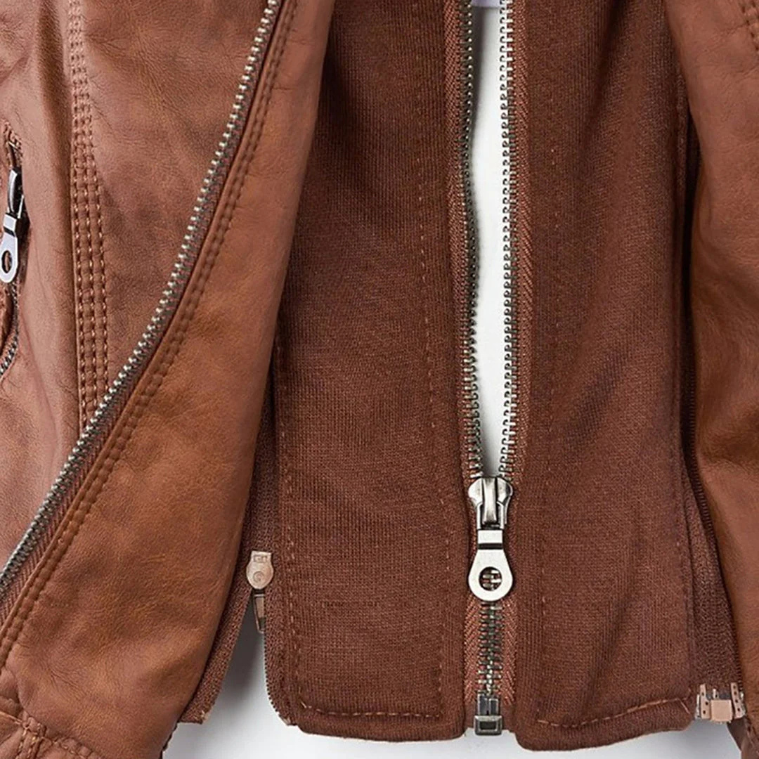 Model wearing a fitted biker-style jacket with a removable hood, front zipper, and zippered pockets._7