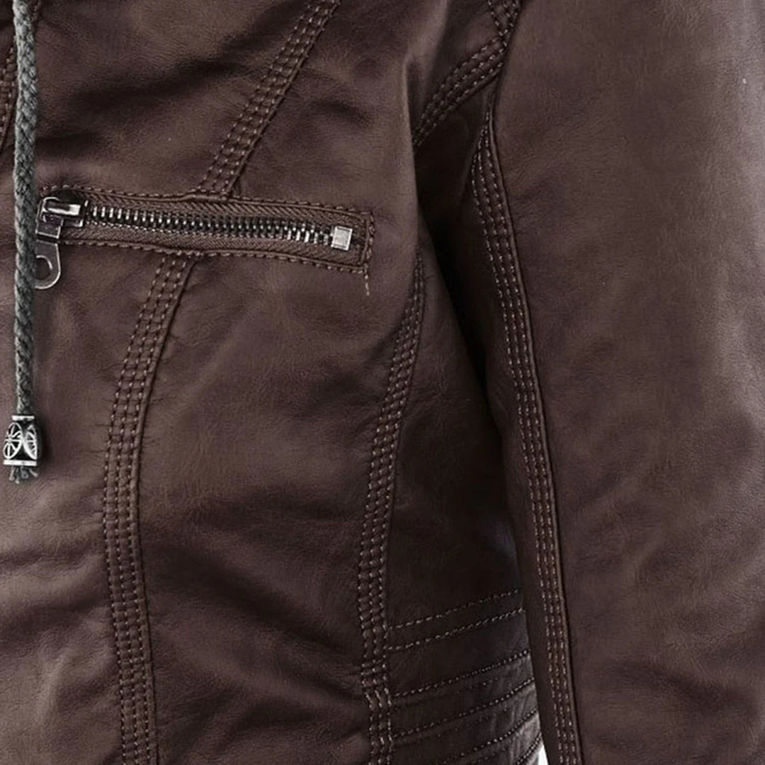Model wearing a fitted biker-style jacket with a removable hood, front zipper, and zippered pockets._8