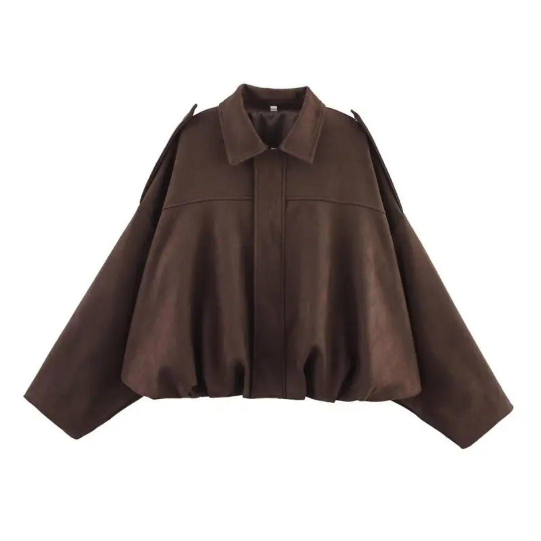 Front view of a woman wearing a relaxed bomber jacket with a pointed collar, balloon sleeves, and a gathered hem._10