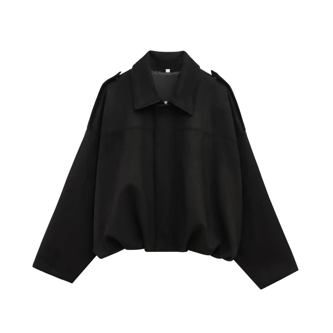 Front view of a woman wearing a relaxed bomber jacket with a pointed collar, balloon sleeves, and a gathered hem._11