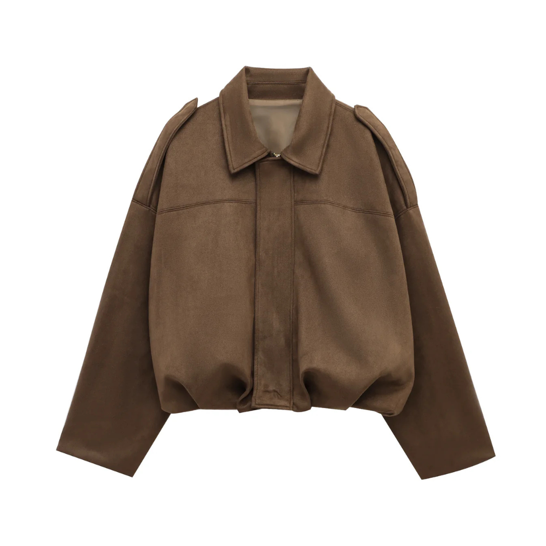 Front view of a woman wearing a relaxed bomber jacket with a pointed collar, balloon sleeves, and a gathered hem._9