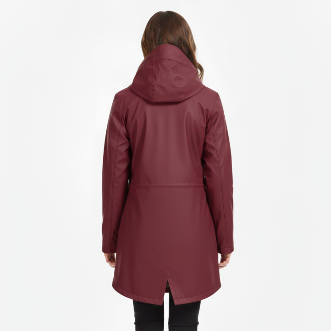 Front view of a model wearing a hooded hip-length rain jacket with a front zipper, flap pockets, and fishtail hem._11