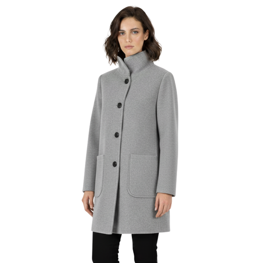 Model wearing a tailored knee length coat with a stand collar, front buttons, and patch pockets._0
