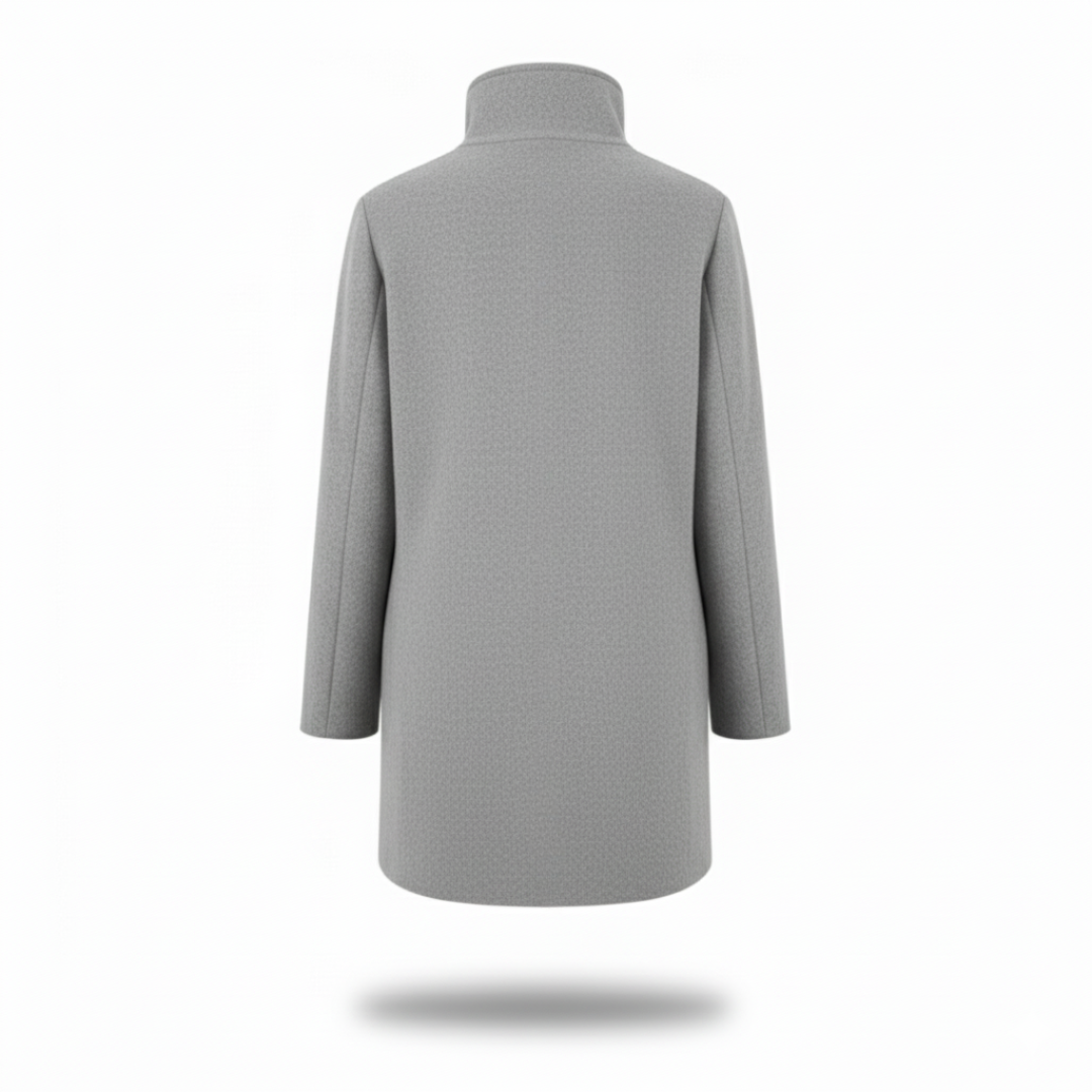 Model wearing a tailored knee length coat with a stand collar, front buttons, and patch pockets._3