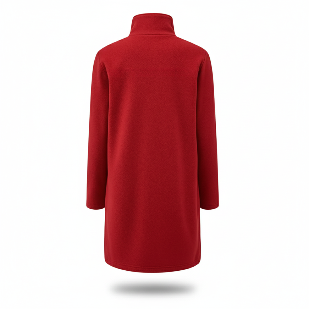 Model wearing a tailored knee length coat with a stand collar, front buttons, and patch pockets._8